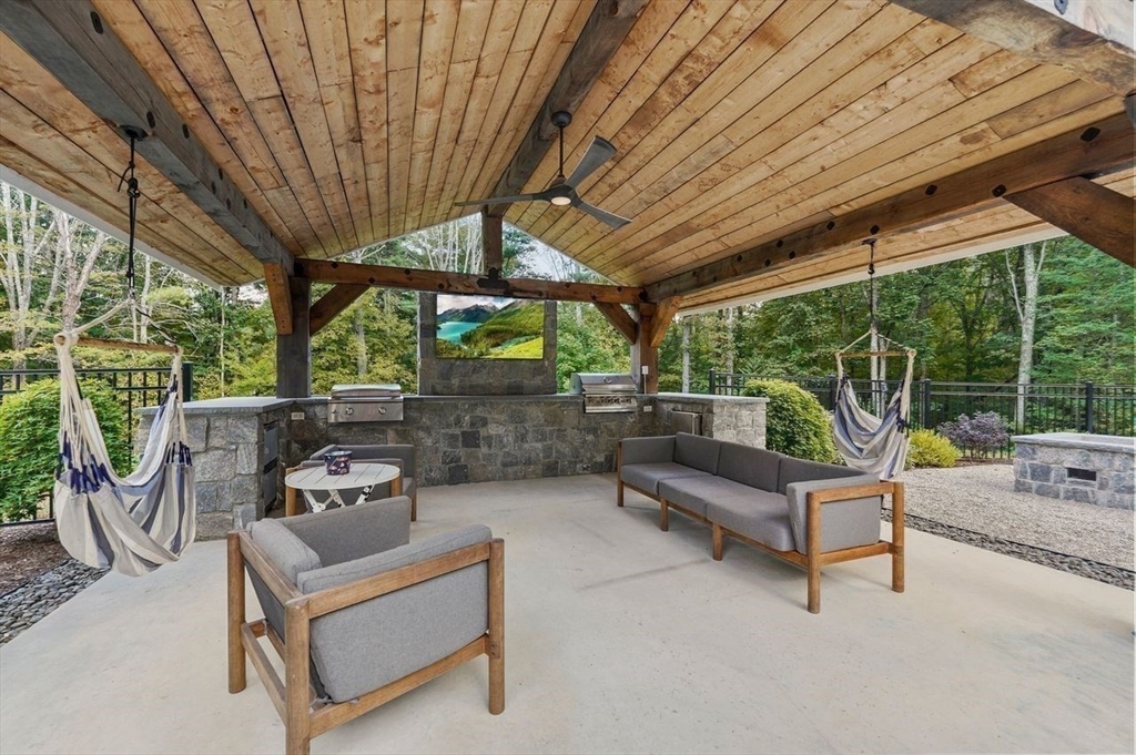 31 Douglas Road Sutton, MA 01590 - Photo 35 of 42 a view of patio with table and chairs potted plants with large tree