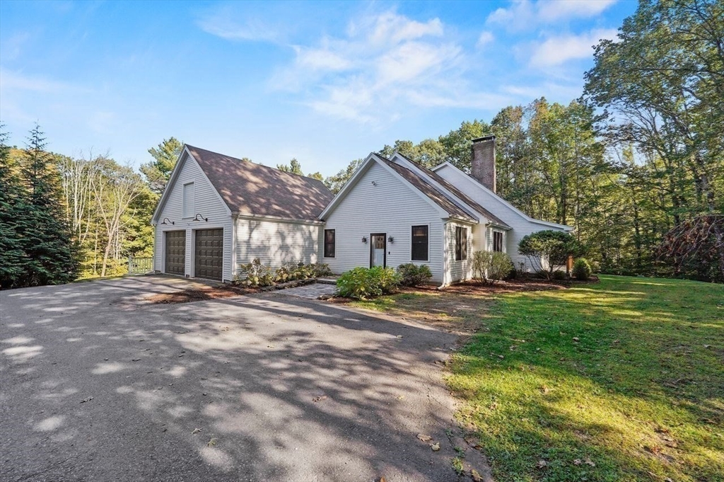 31 Douglas Road Sutton, MA 01590 - Photo 40 of 42 a view of a house with a yard