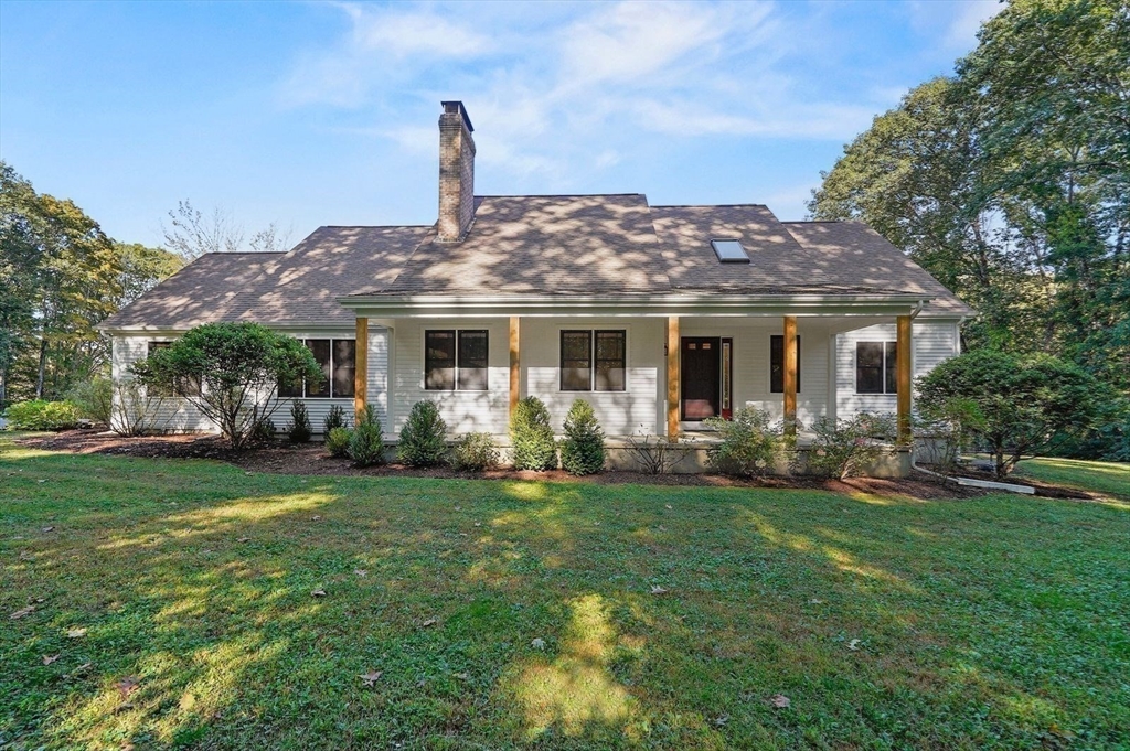 31 Douglas Road Sutton, MA 01590 - Photo 5 of 42 a front view of a house with a garden