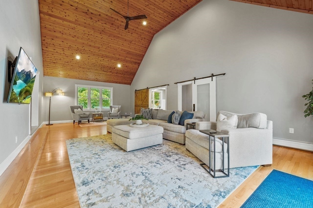 31 Douglas Road Sutton, MA 01590 - Photo 8 of 42 a living room with furniture and a wooden floor
