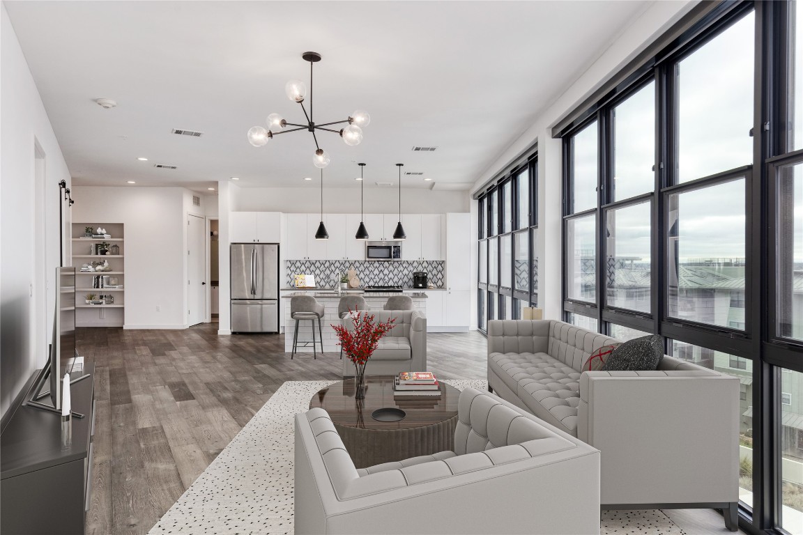 800 Embassy Drive, Unit 425 Austin, TX 78702 - Photo 1 of 1 a living room with furniture and a large window