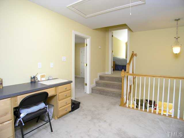 7413 Fontana Ridge Lane Raleigh, NC 27613 - Photo 16 of 25 Upstairs loft with built in desk area provides even more room for your office needs. Loft
