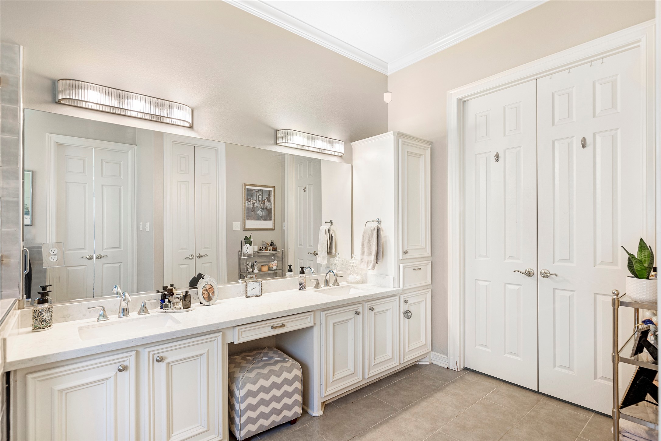 6530 Treaschwig Road, Unit 1 Spring, TX 77373 - Photo 20 of 32 a bathroom with double vanity sinks and a mirror