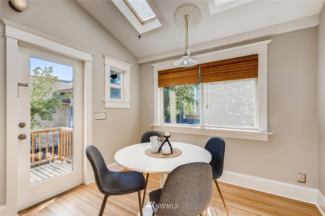117 24th Avenue Seattle, WA 98122 - Photo 17 of 39 a view of a dining room with furniture window and wooden floor