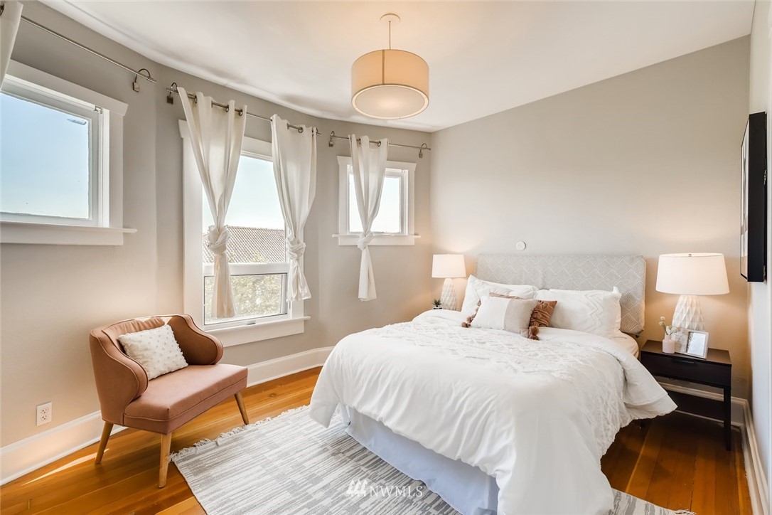 117 24th Avenue Seattle, WA 98122 - Photo 18 of 39 a bedroom with a bed and a window