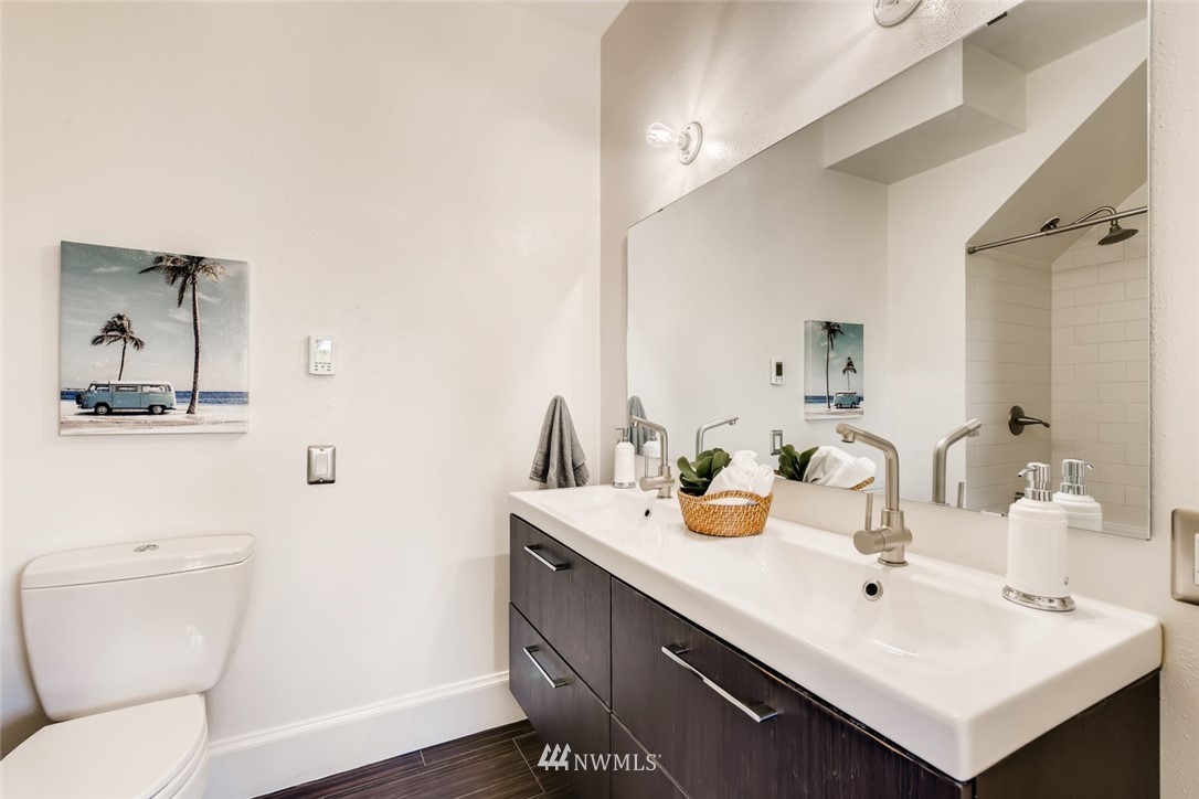 117 24th Avenue Seattle, WA 98122 - Photo 20 of 39 a bathroom with a sink mirror and toilet