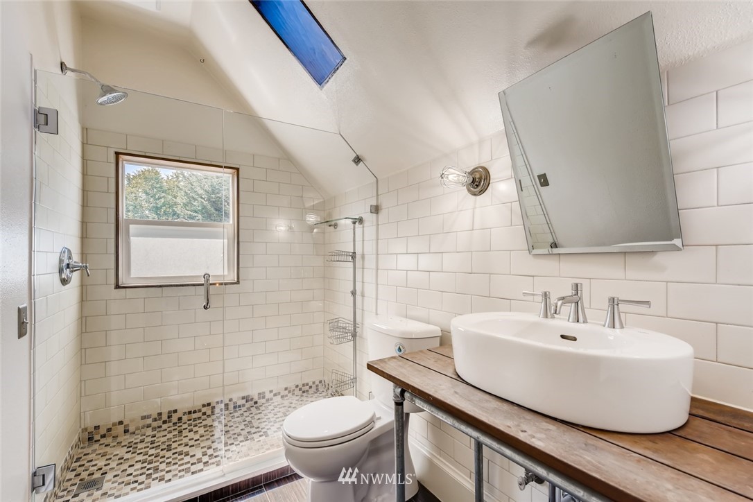 117 24th Avenue Seattle, WA 98122 - Photo 22 of 39 a bathroom with a sink toilet and shower