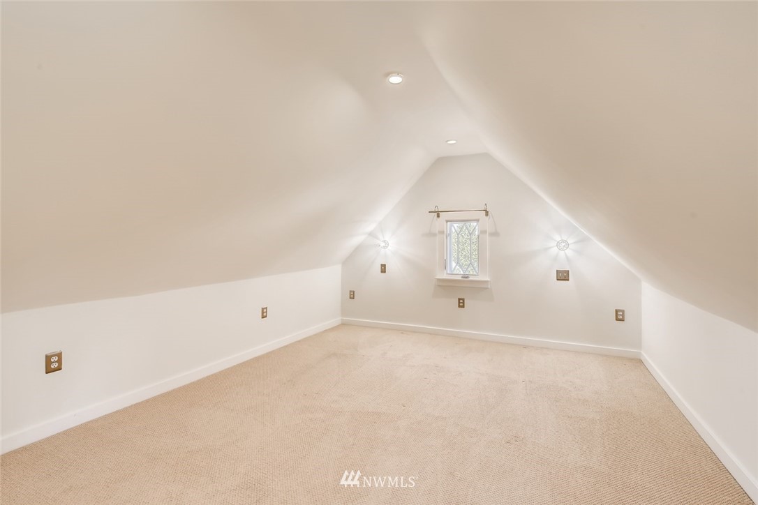 117 24th Avenue Seattle, WA 98122 - Photo 24 of 39 an empty room with staircase and white walls