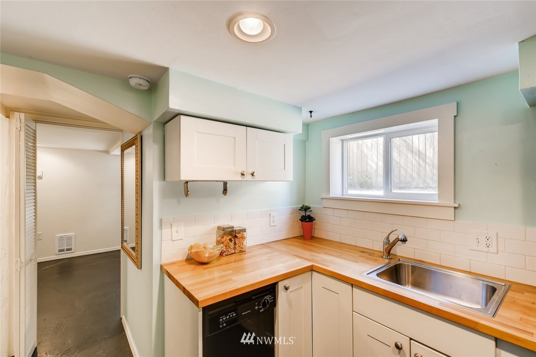 117 24th Avenue Seattle, WA 98122 - Photo 28 of 39 a kitchen with a sink and a stove top oven