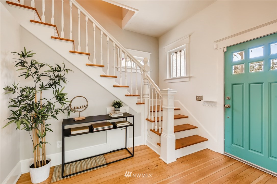 117 24th Avenue Seattle, WA 98122 - Photo 4 of 39 a view of entryway with wooden floor and stairs