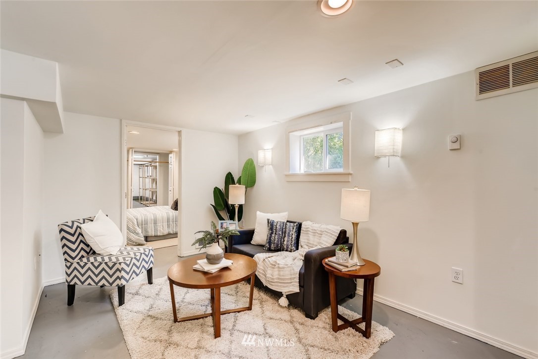 117 24th Avenue Seattle, WA 98122 - Photo 32 of 39 a living room with furniture and wooden floor