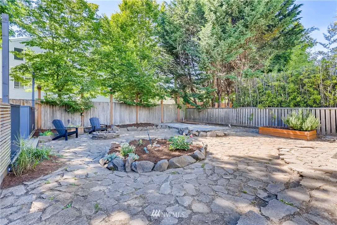 117 24th Avenue Seattle, WA 98122 - Photo 36 of 39 a view of a backyard with furniture and a fire pit