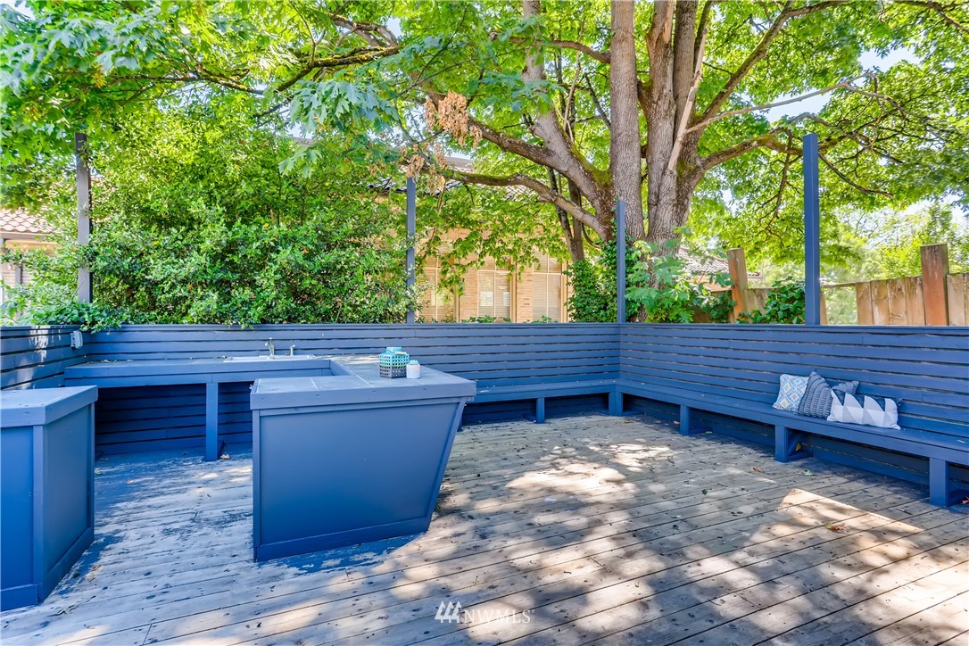 117 24th Avenue Seattle, WA 98122 - Photo 37 of 39 a backyard of a house with wooden fence and trees