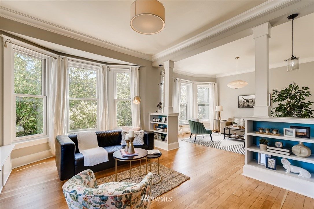 117 24th Avenue Seattle, WA 98122 - Photo 8 of 39 a living room with furniture and a book shelf