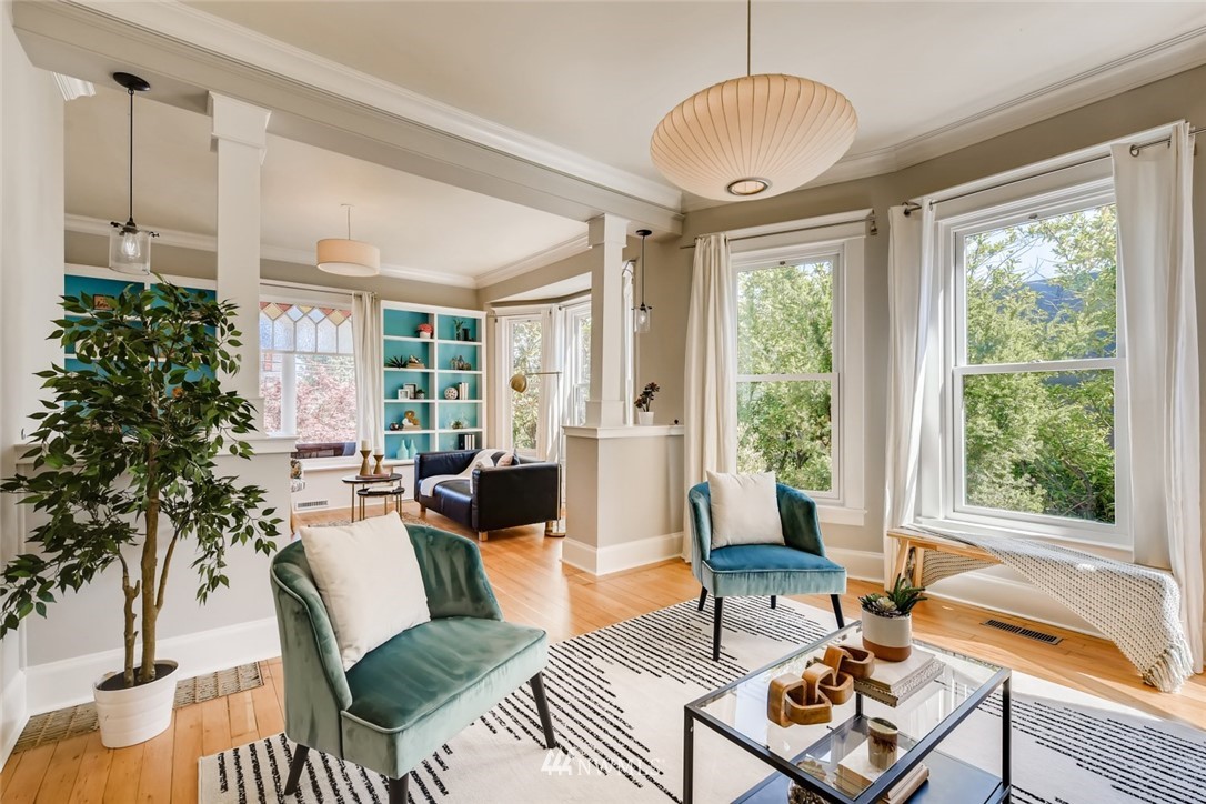 117 24th Avenue Seattle, WA 98122 - Photo 9 of 39 a living room with furniture and a large window