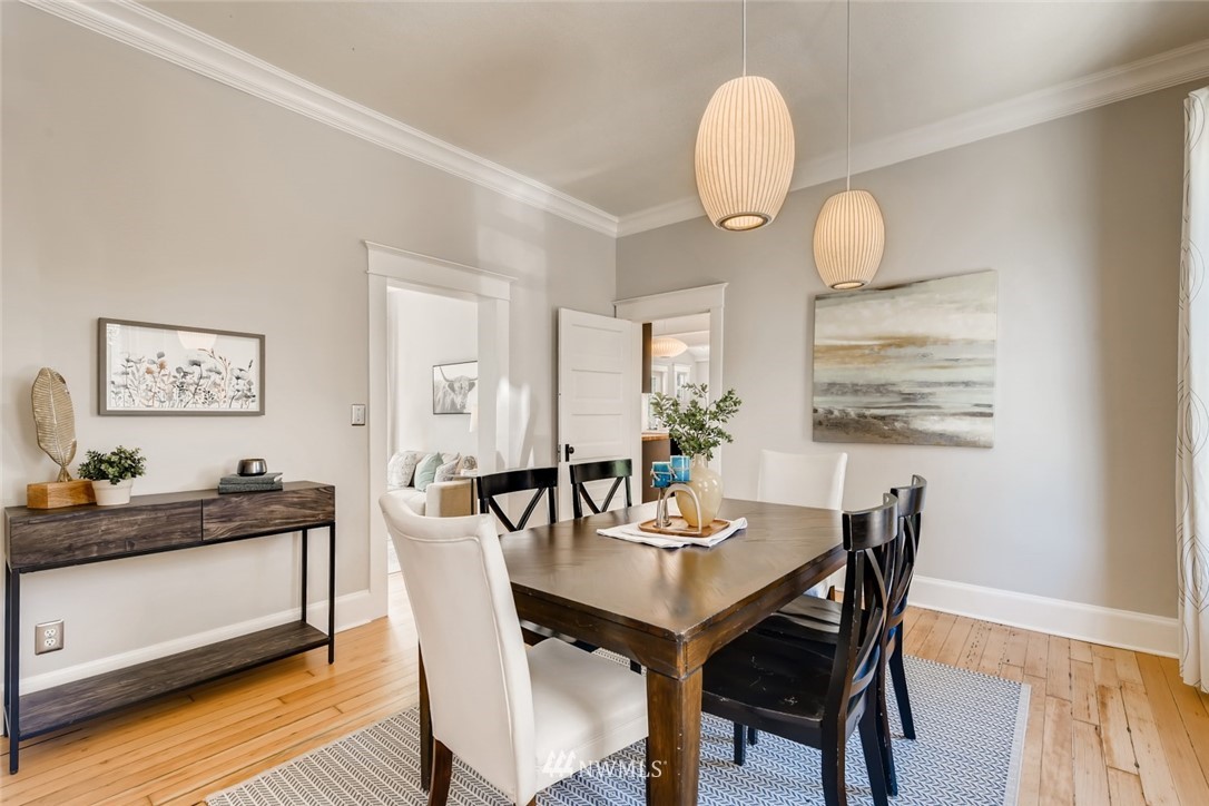 117 24th Avenue Seattle, WA 98122 - Photo 10 of 39 a view of a dining room with furniture and wooden floor