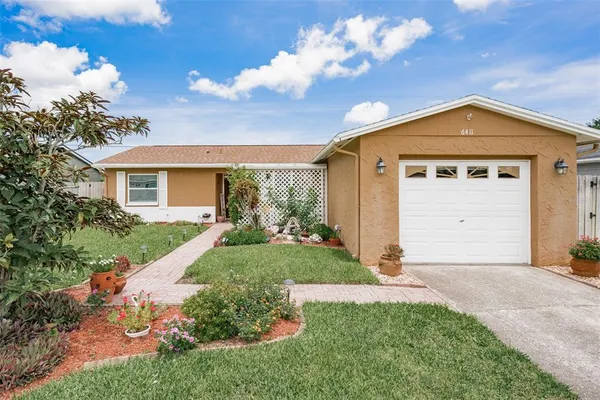 a view of a house with a yard