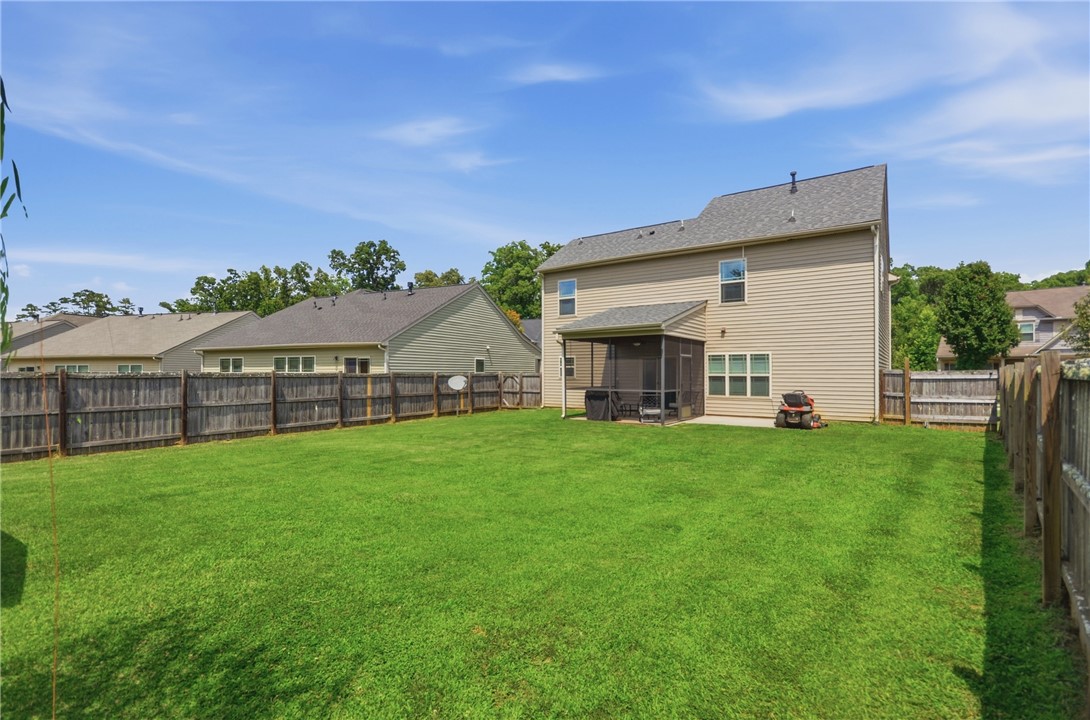 347 Riverdale Road Simpsonville, SC 29680 - Photo 25 of 30 A generous backyard offers a private outdoor haven for relaxation and play.