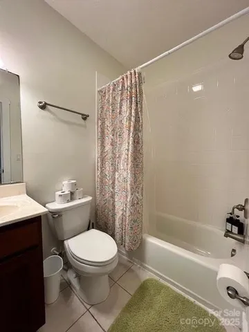 a bathroom with a toilet a sink and a bathtub