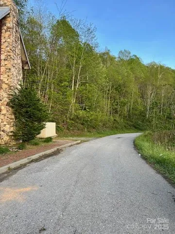 a view of a field with a view of mountains