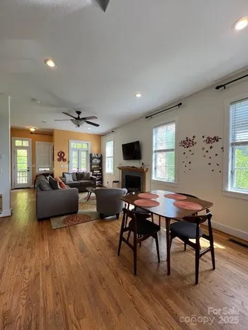 a living room with furniture a table and a flat screen tv