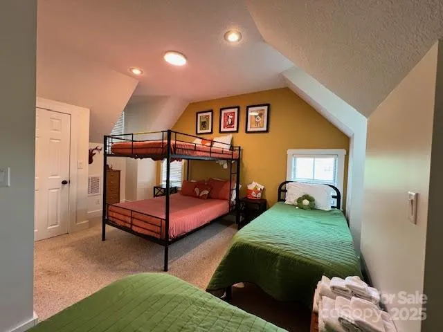 a bedroom with furniture and a baby crib