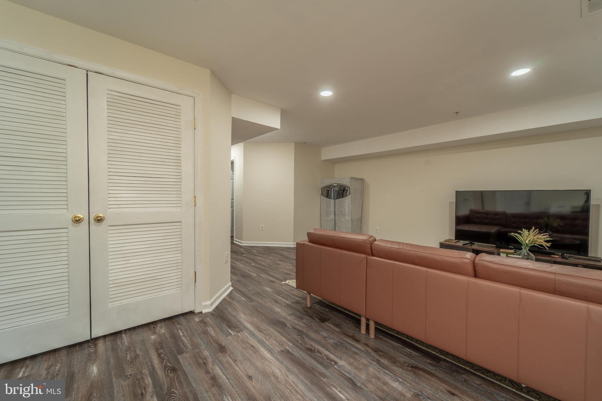 9659 Biggs Road Baltimore, MD 21220 - Photo 20 of 26 a living room with furniture and a flat screen tv