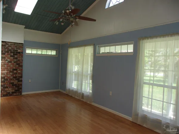a bathroom with a sink a mirror a shower and vanity