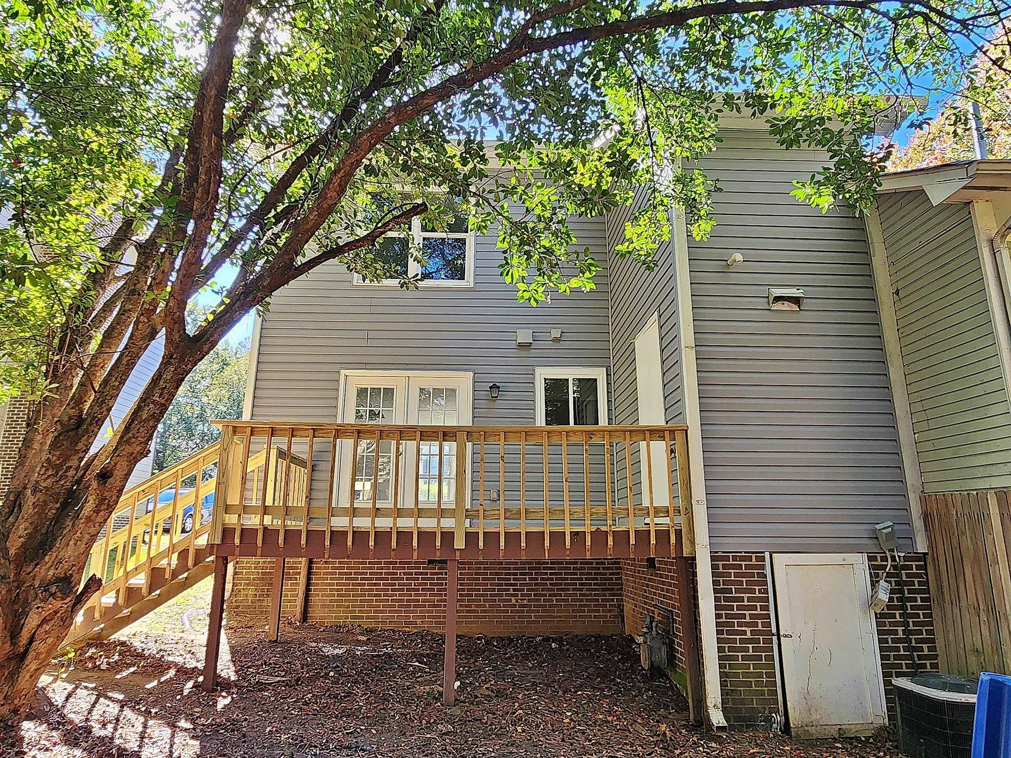 3303 Comstock Road Raleigh, NC 27604 - Photo 3 of 18 a view of a house with a yard and a tree