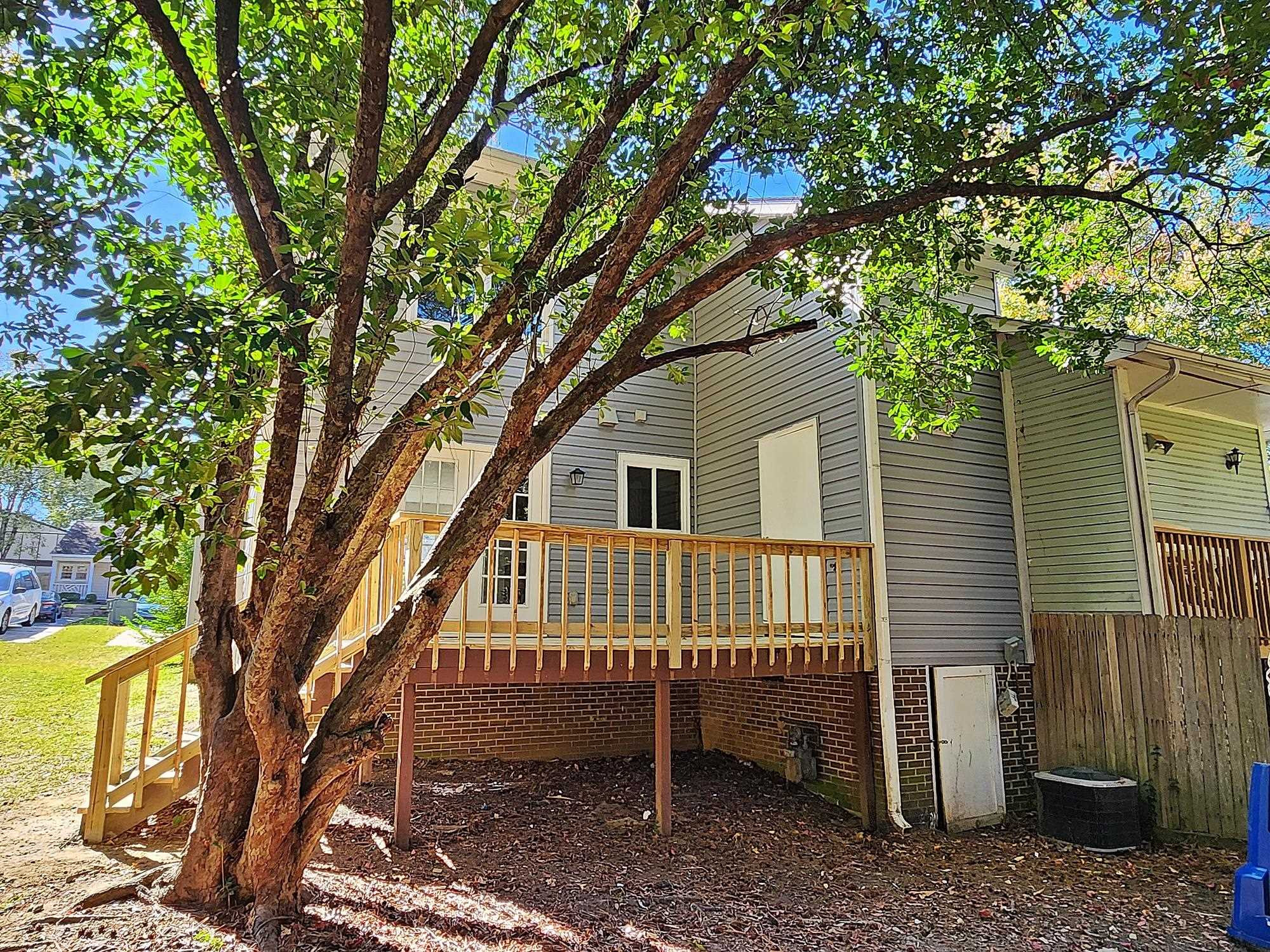 3303 Comstock Road Raleigh, NC 27604 - Photo 5 of 18 a view of a house with a yard