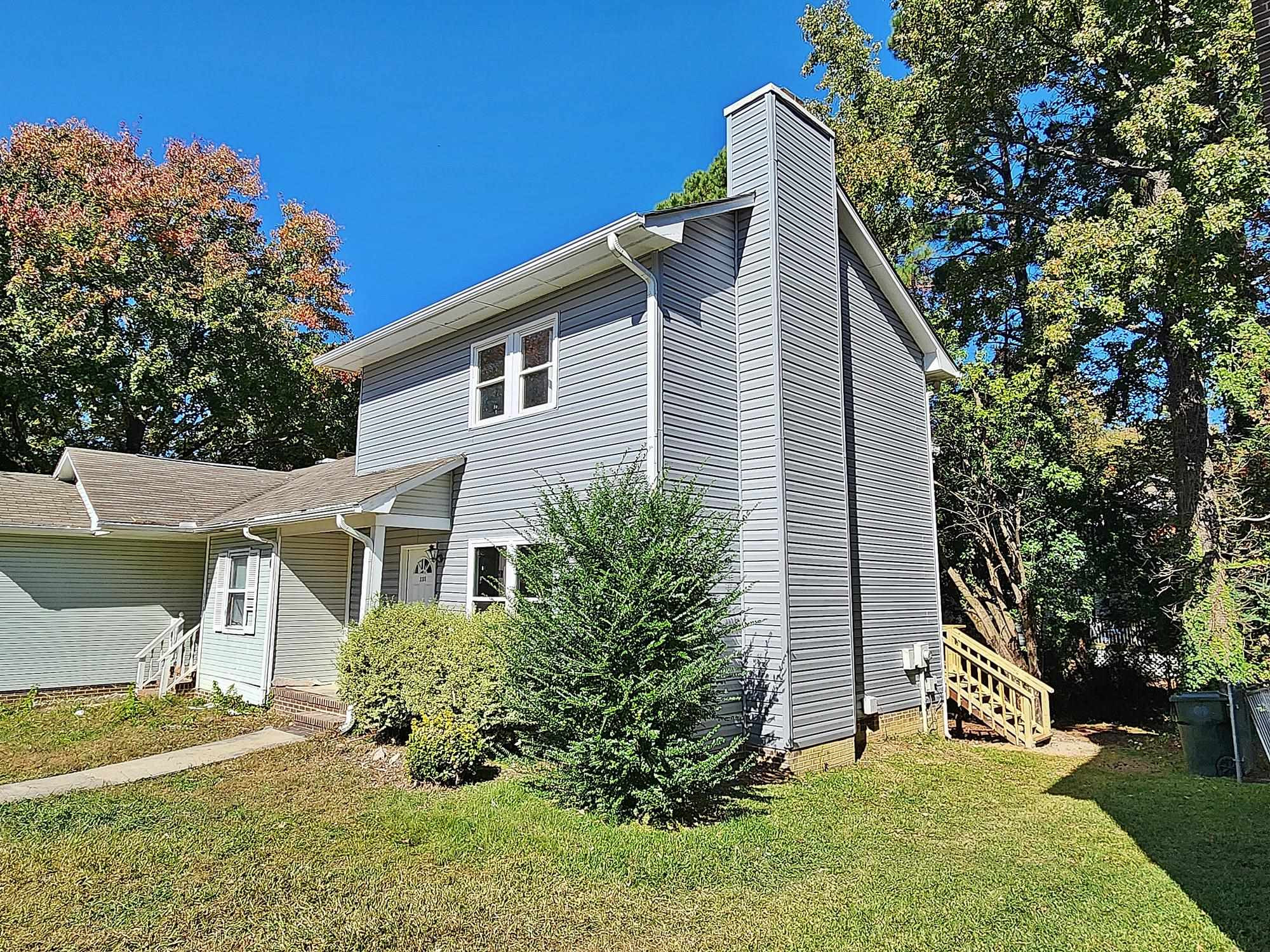 3303 Comstock Road Raleigh, NC 27604 - Photo 6 of 18 a view of a house with a yard
