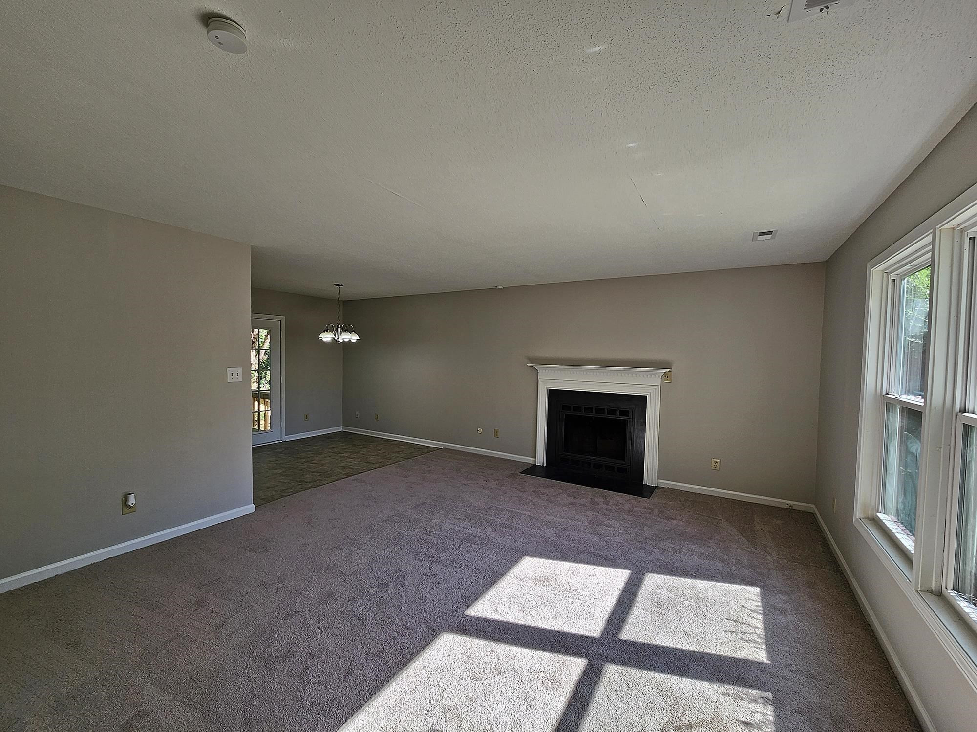 3303 Comstock Road Raleigh, NC 27604 - Photo 7 of 18 an empty room with windows