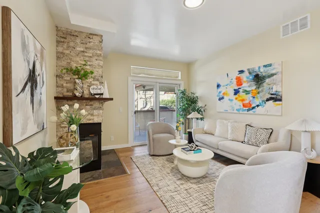 a living room with furniture and a fireplace