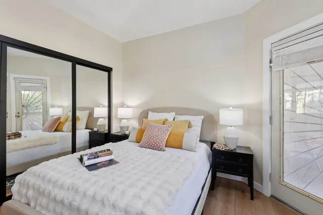 a bedroom with a bed and a window