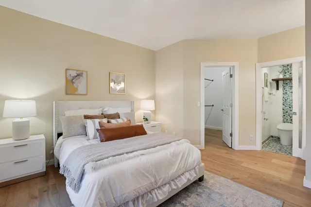 a bathroom with a double vanity sink mirror double and bathtub