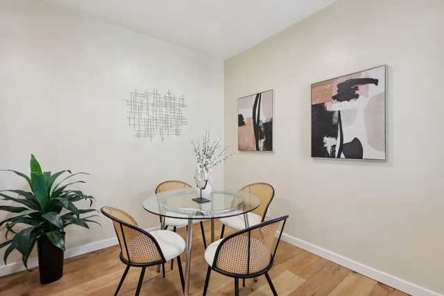 a dining room with furniture and window