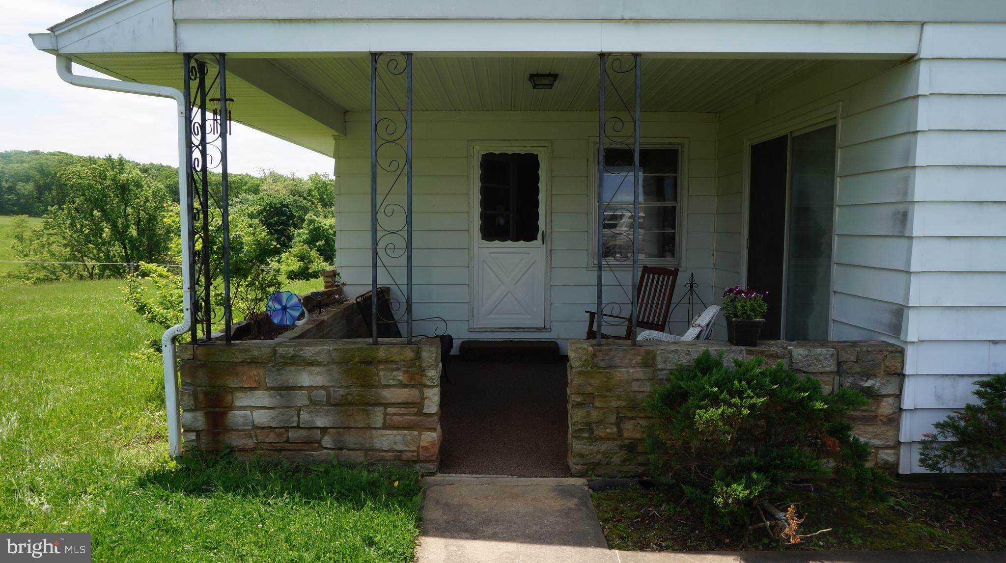 318 Cross Road Berkeley Springs, WV 25411 - Photo 2 of 16 Covered side porch