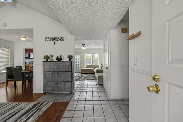a living room with furniture rug and window
