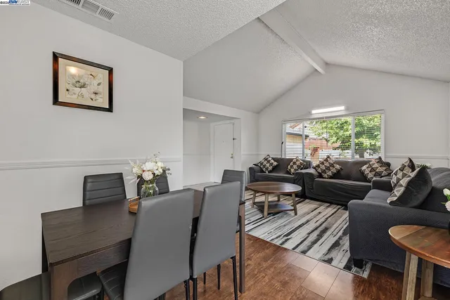 a living room with furniture and a rug