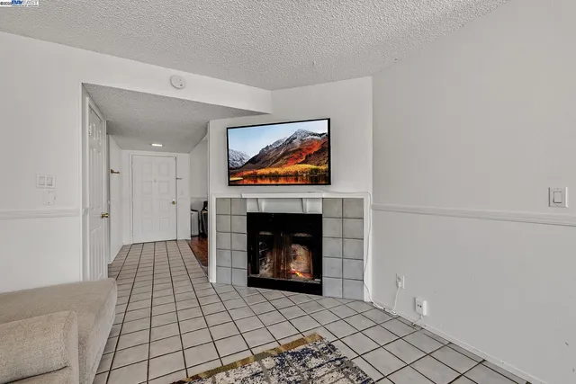 a kitchen with granite countertop a refrigerator and a sink