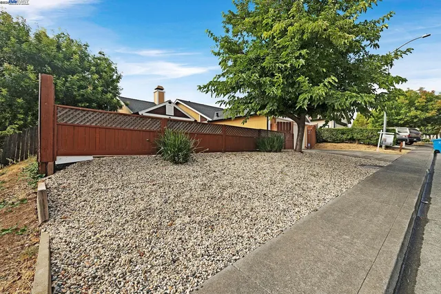 a view of a backyard of the house