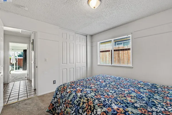 a bedroom with a bed and a gate