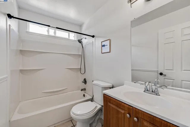 a bedroom with bed and large window