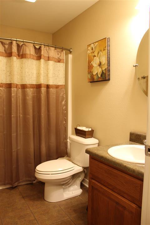 3444 King Lake Road DeFuniak Springs, FL 32433 - Photo 20 of 29 a white toilet sitting next to a bathroom sink