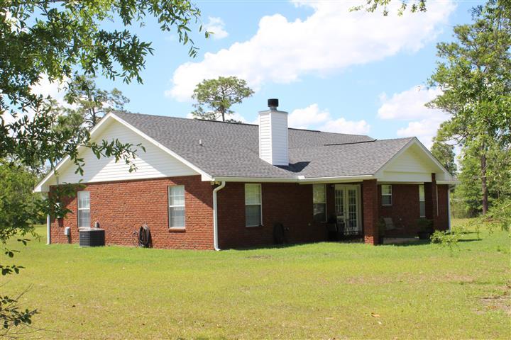 3444 King Lake Road DeFuniak Springs, FL 32433 - Photo 5 of 29 a front view of a house with a yard and garage