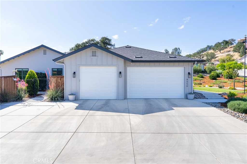 8550 El Corte Road Atascadero, CA 93422 - Photo 42 of 72 The attached 3-car garage is oversized and has side mount garage door openers and a tankless water heater.