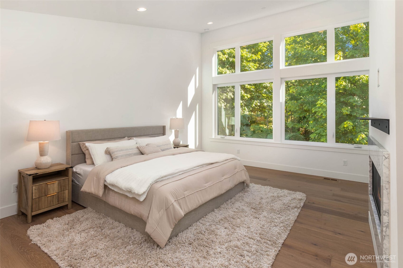 21029 Southeast 80th Street Issaquah, WA 98027 - Photo 19 of 25 a bedroom with a large bed and a large window