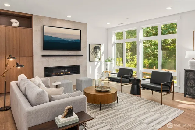 a living room with furniture fireplace and a flat screen tv