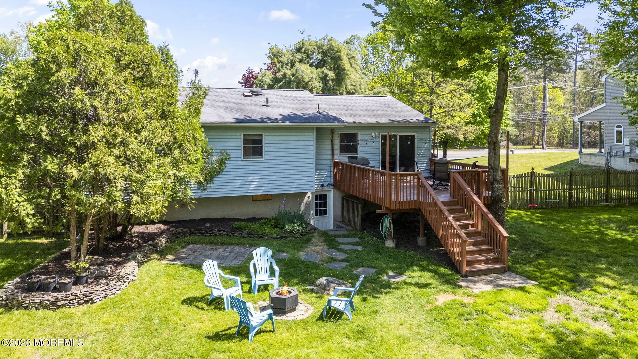 356 Leesville Road Jackson, NJ 08527 - Photo 37 of 46 a backyard of a house with table and chairs