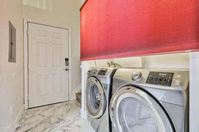 a utility room with dryer and washer